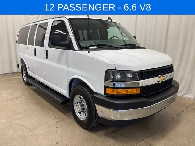 2025 Chevrolet Express Passenger 1LT in Summit White — front three-quarter view