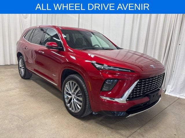 2026 Buick Enclave Avenir in Cherry Red Tintcoat — front three-quarter view