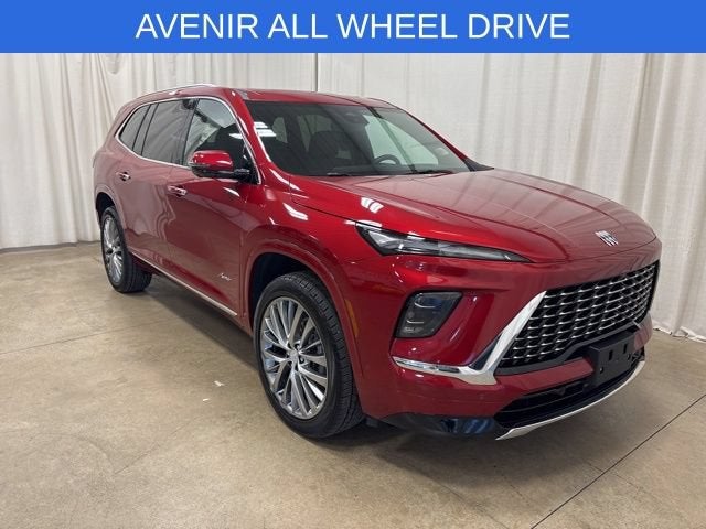 2025 Buick Enclave Avenir in Cherry Red Tintcoat — front three-quarter view